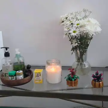 Massage oils, candle and fresh flowers in Anya’s private Maidenhead studio.
